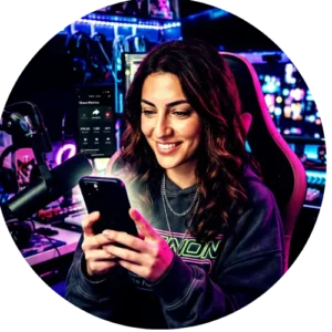 A female creator reviewing affordable high volume TikTok share metrics on her phone in a modern workspace.